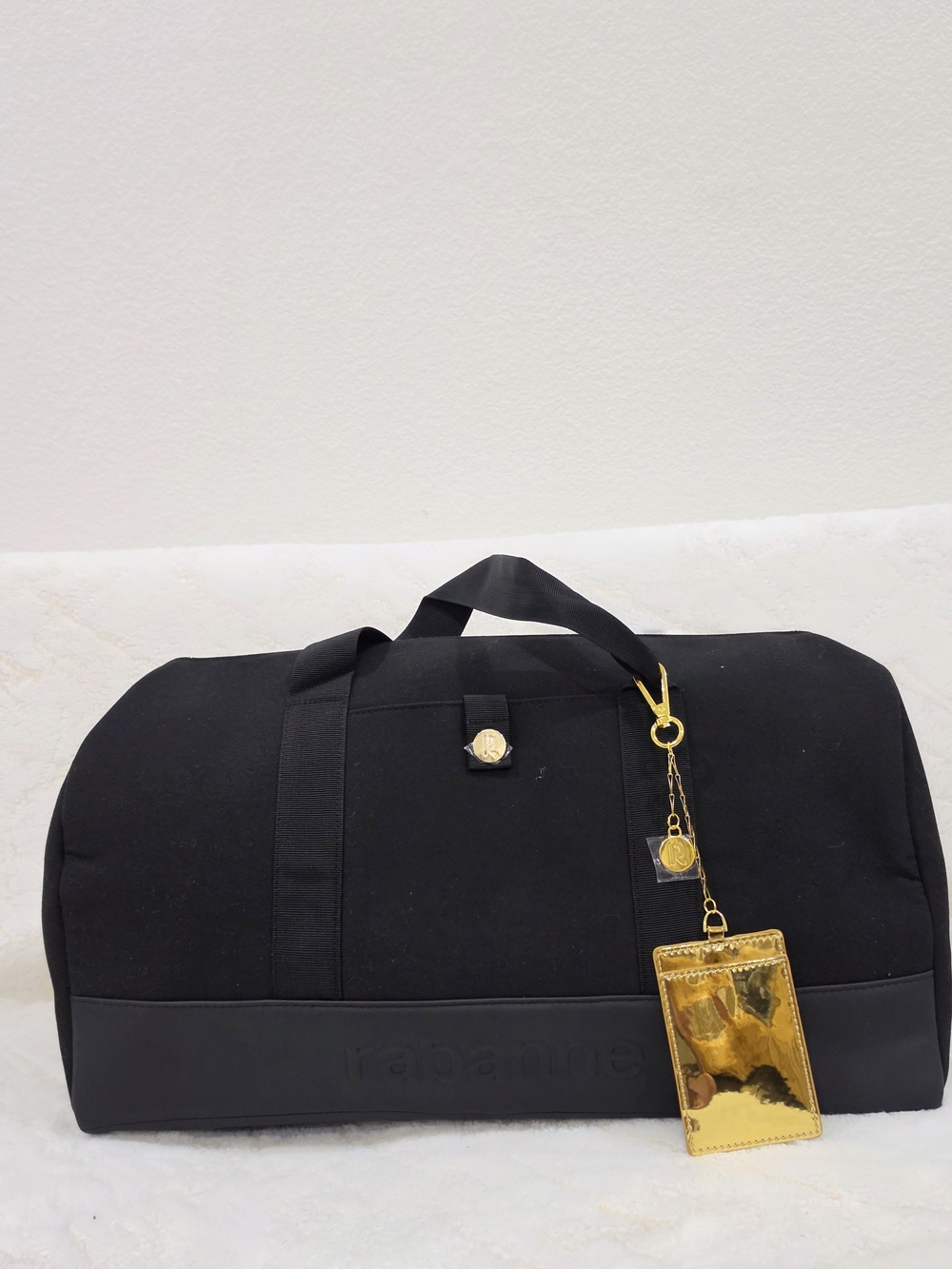 Rabanne Black Weekend Duffel Bag with Gold Accent.